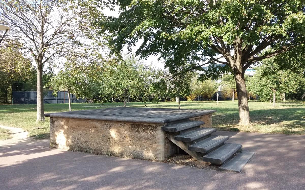 The stone bandstand in Gerland park, Lyon, under the trees and empty of people